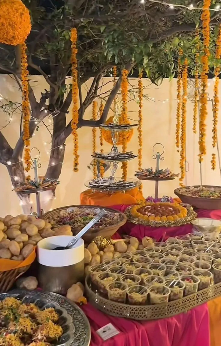 Chaat and golgappa station under marigold garlands for a Maiyan event