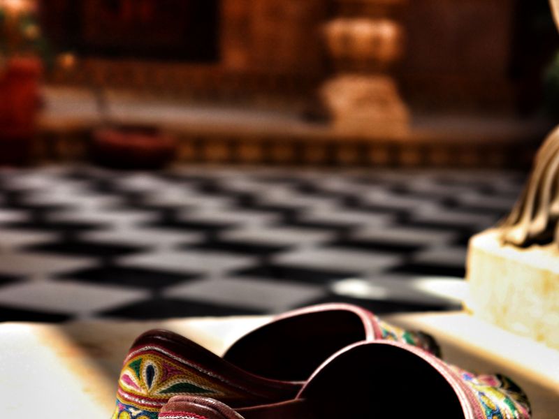 Embroidered Punjabi jutti resting on a marble step