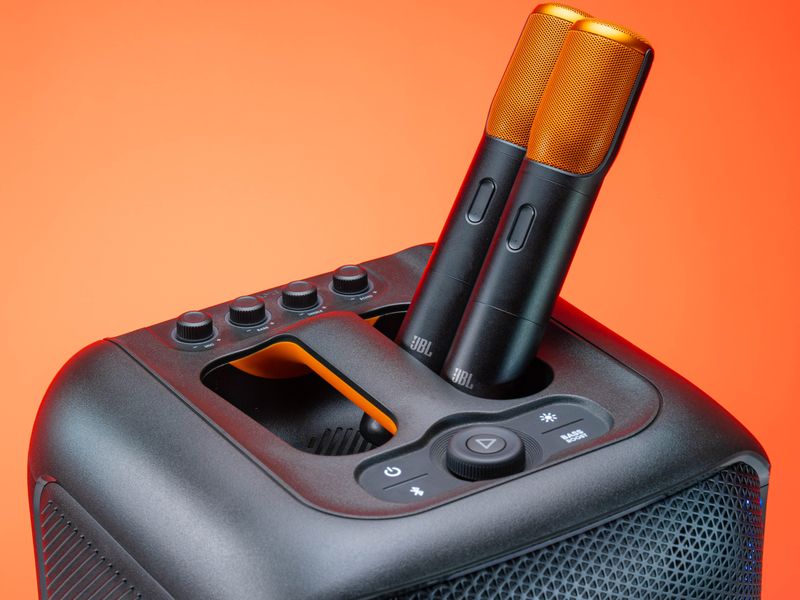 Portable party speaker with two wireless microphones